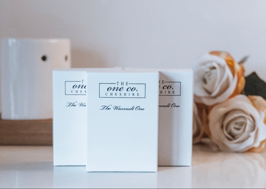 The One Co Cheshire waxmelts in boxes with a burner and flowers